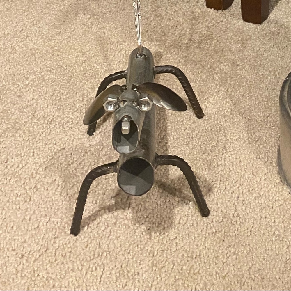Art piece made using various metal items. Bought at art show. 🐕